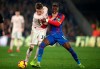 Manchester United's Scott McTominay, left, in action with Crystal Palace's Wilfried Zaha, during the English Premier League soccer match at Selhurst Park in London, Wednesday Feb. 27, 2019. (John Walton/PA via AP)