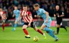 Sheffield United's John Lundstram, left, and Burnley's Charlie Taylor battle for the ball during the English Premiership League soccer match at Bramall Lane, Sheffield, England, Saturday Nov. 2, 2019. (Danny Lawson/PA via AP)