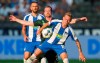 Maximilian Arnold from VfL Wolfsburg, center, and Berlin's Ondrej Duda, front, battle for the ball during the German Bundesliga soccer match between VfL Wolfsburg and Hertha BSC Berlin in Berlin, Germany, Sunday, Aug. 25, 2019. (Andreas Gora/dpa via AP)