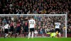 Fulham's Aboubakar Kamara, 47, right, has a penalty saved by Huddersfield Town goalkeeper Jonas Lossl, during their English Premier League soccer match at Craven Cottage in London, Saturday Dec. 29, 2018. (Yui Mok/PA via AP)