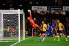 Watford goalkeeper Ben Foster saves a shot on goal from Chelsea's Tammy Abraham, second right, during the English Premiership League soccer match at Vicarage Road, Watford, England, Saturday Nov. 2, 2019. (John Walton/PA via AP)