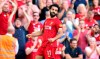 Liverpool's Mohamed Salah celebrates scoring during the English Premier League soccer match against Arsenal at Anfield, Liverpool, England, Saturday Aug. 24, 2019. (Anthony Devlin/PA via AP)