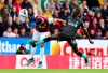Burnley's Matthew Lowton, left, and Liverpool's Sadio Mane battle for the ball during the English Premier League soccer match at Turf Moor, Burnley, England, Saturday Aug. 31, 2019. (Anthony Devlin/PA via AP)