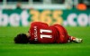 Liverpool's Mohamed Salah lies injured during a Premier League match against Newcastle United at St James' Park, Newcastle, England, Saturday May 4, 2019. (Owen Humphreys/PA via AP)