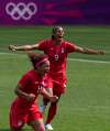 Frank Gunn / THE CANADIAN PRESS
Canada defender Candace Chapman (9) and midfielder Desiree Scott (11) celebrate after winning the Bronze medal football game at the Olympic Games in Coventry, Great Britain, on Thursday.