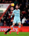 Bournemouth's Steve Cook, left, and Chelsea's Gonzalo Higuain during their English Premier League soccer match at the Vitality Stadium in Bournemouth, Wednesday Jan. 30, 2019. (Andrew Matthews/PA via AP)