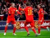 Wales' Aaron Ramsey celebrates scoring his side's first goal of the game against Hungary, with team-mates Gareth Bale, left, and Joe Allen, right, during their UEFA Euro 2020 Qualifying soccer match at the Cardiff City Stadium, in Cardiff, Wales, Tuesday Nov. 19, 2019. (Nick Potts/PA via AP)