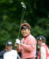 Tadahiro Takayama of Japan warms up prior to playing the 1st hole at Royal Lytham & St. Annes golf club during the first round of the British Open Golf Championship at Lytham St. Annes, England, Thursday, July 19, 2012. (AP Photo/Jon Super)