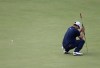 Adam Scott of Australia reacts after missing a putt on the 18th green at Royal Lytham & St Annes golf club during the final round of the British Open Golf Championship, Lytham St Annes, England Sunday, July 22, 2012. (AP Photo/Tim Hales)