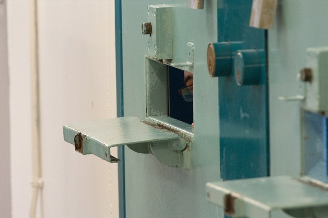 An inmate can be seen inside a segregation cell during a media tour of the Collins Bay Institution in Kingston, Ont., on Tuesday, May 10, 2016. People convicted of minor offences would pay less than those guilty of serious crimes when applying for a pardon under a scenario being studied by the federal parole board. THE CANADIAN/Lars Hagberg