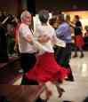 Melissa Tait / Winnipeg Free Press
Lillian Wright (in red skirt) and partner Ken Palen dance at the Norwood St. Boniface Legion weekly Saturday Night Dance.