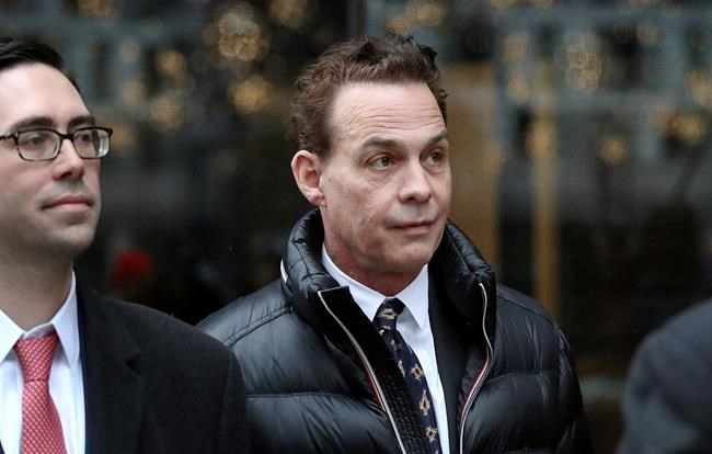 In this March 27, 2019, photo, Robert Zangrillo departs federal court in Boston after a hearing in a nationwide college admissions bribery scandal. Lawyers for Zangrillo plan to argue that he isn’t much different from parents who make formal donations to schools in the hopes of giving their children an edge in admissions. (Craig F. Walker/The Boston Globe via AP)