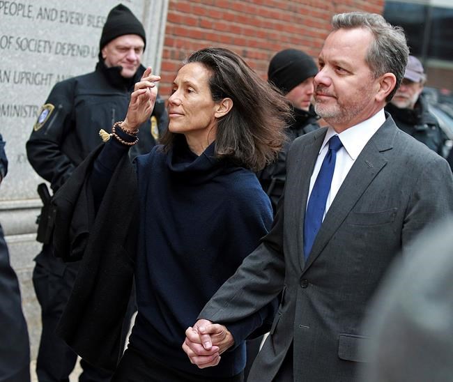 FILE - In this Friday, March 29, 2019 file photo, William McGlashan, 55, of Mill Valley, Calif., a senior executive at TPG private equity firm, arrives at the federal courthouse for a hearing associated with the college admissions bribery scandal in Boston. On Tuesday, April 9 McGlashan was among 16 prominent parents indicted on an additional charge of money laundering conspiracy in the case. (Matt Stone/The Boston Herald via AP, File)