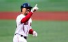 Boston Red Sox's Mookie Betts smiles as he crosses home plate on his solo home run off Oakland Athletics starting pitcher Aaron Brooks in the first inning of a baseball game at Fenway Park, Tuesday, April 30, 2019, in Boston. (AP Photo/Charles Krupa)