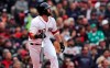 Boston Red Sox's Mitch Moreland watches the flight of his solo home run off Oakland Athletics pitcher Mike Fiers during the fourth inning of a baseball game at Fenway Park, Wednesday, May 1, 2019, in Boston. (AP Photo/Charles Krupa)