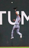 Detroit Tigers center fielder JaCoby Jones leaps to make the catch on a fly out by Boston Red Sox'sJackie Bradley Jr. during the sixth inning of a baseball game at Fenway Park, Wednesday, April 24, 2019, in Boston. (AP Photo/Charles Krupa)