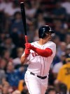 Boston Red Sox's Rafael Devers watches his two-RBI double during the fourth inning of a baseball game agains the Toronto Blue Jays at Fenway Park in Boston, Wednesday, July 17, 2019. (AP Photo/Charles Krupa)