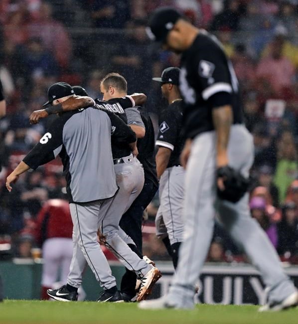 Chicago White Sox's Tim Anderson is helped from the field after an injury during the fifth inning of a baseball game against the Boston Red Sox at Fenway Park in Boston, Tuesday, June 25, 2019. (AP Photo/Charles Krupa)