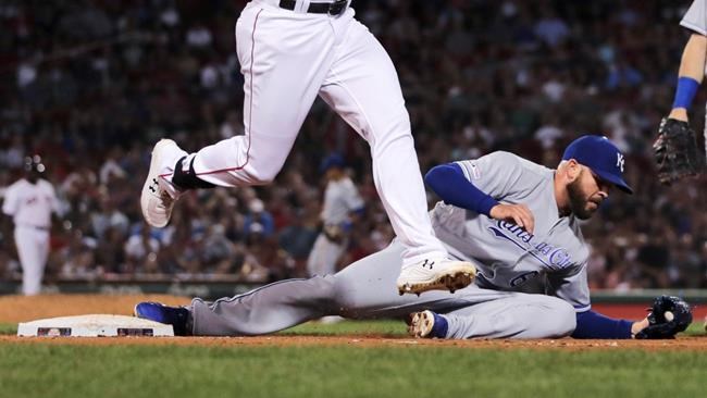 Kansas City Royals relief pitcher Kevin McCarthy, right, makes the force while covering first on a ground out by Boston Red Sox's Jackie Bradley Jr. during the sixth inning of a baseball game at Fenway Park in Boston, Monday, Aug. 5, 2019. (AP Photo/Charles Krupa)