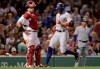 Texas Rangers' Hunter Pence, right, crosses home plate in front of Boston Red Sox catcher Christian Vazquez, left, while scoring on his inside the park home run in the sixth inning of a baseball game at Fenway Park in Boston, Tuesday, June 11, 2019. (AP Photo/Charles Krupa)