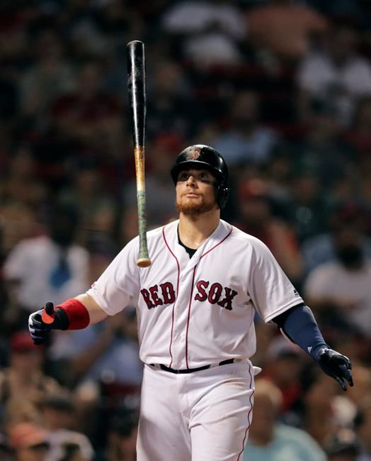 Boston Red Sox's Christian Vazquez flips his bat after striking out during the eighth inning of the team's baseball game against the Tampa Bay Rays at Fenway Park in Boston, Tuesday, July 30, 2019. (AP Photo/Charles Krupa)