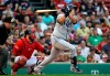 Tampa Bay Rays' Ji-Man Choi watches a solo home run in front of Boston Red Sox catcher Sandy Leon during the second inning of a baseball game at Fenway Park, Friday, June 7, 2019, in Boston. (AP Photo/Elise Amendola)