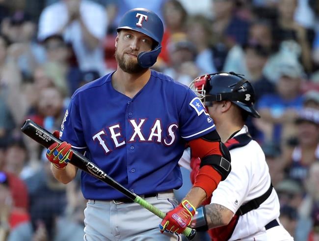 Texas Rangers' Hunter Pence reacts after striking out and leaving runners on, to end the eighth inning of a baseball game against the Boston Red Sox at Fenway Park, Wednesday, June 12, 2019, in Boston. (AP Photo/Elise Amendola)