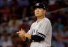 New York Yankees starting pitcher Masahiro Tanaka rubs the ball as he is taken out in the fourth inning of a baseball game against the Boston Red Sox at Fenway Park, Thursday, July 25, 2019, in Boston. (AP Photo/Elise Amendola)