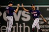 Minnesota Twins' C.J. Cron (24) and Byron Buxton (25) celebrate the team's 6-5 victory over the Boston Red Sox in a baseball game at Fenway Park, Tuesday, Sept. 3, 2019, in Boston. (AP Photo/Elise Amendola)