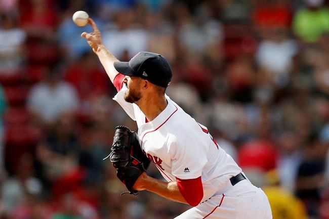 Boston Red Sox's Rick Porcello pitches during the first inning of a baseball game against the Los Angeles Angels in Boston, Saturday, Aug. 10, 2019. (AP Photo/Michael Dwyer)