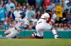 Los Angeles Dodgers' Chris Taylor (3) scores behind Boston Red Sox's Sandy Leon on a single by A.J. Pollock during the first inning of a baseball game in Boston, Saturday, July 13, 2019. (AP Photo/Michael Dwyer)