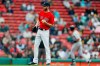 Boston Red Sox's Chris Sale stands on the mound after giving up a solo home run to Detroit Tigers' Grayson Greiner, right, during the fifth inning in the first game of a baseball doubleheader in Boston, Tuesday, April 23, 2019. (AP Photo/Michael Dwyer)