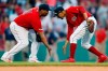 Boston Red Sox's Mookie Betts, right, and Rafael Devers celebrate after defeating the New York Yankees during a baseball game in Boston, Saturday, July 27, 2019. (AP Photo/Michael Dwyer)