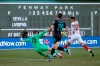Liverpool goalie Andy Longergan (75) dives to make a save as Sevilla's Ocampos Lucas Ariel (25) tries to score past him and Liverpool's Andy Robertson (26) during the first half of a friendly soccer match at Fenway Park, Sunday, July 21, 2019, in Boston. (AP Photo/Mary Schwalm)