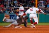 Boston Red Sox shortstop Xander Bogaerts (2) tags out Cleveland Indians' Leonys Martin at second during the third inning of a baseball game Wednesday, May 29, 2019, in Boston. (AP Photo/Mary Schwalm)