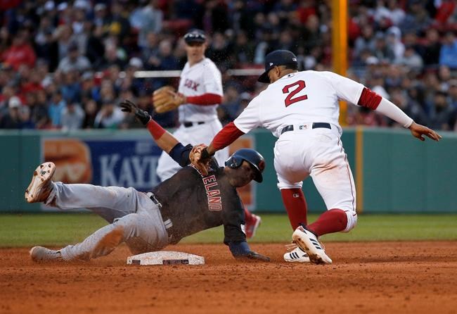 Boston Red Sox shortstop Xander Bogaerts (2) tags out Cleveland Indians' Leonys Martin at second during the third inning of a baseball game Wednesday, May 29, 2019, in Boston. (AP Photo/Mary Schwalm)