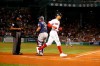 Boston Red Sox's Mookie Betts crosses home plate nexgt to Minnesota Twins catcher Willians Astudillo (64) after hitting a home run during the first inning of a baseball game Wednesday, Sept. 4, 2019, in Boston. (AP Photo/Mary Schwalm)