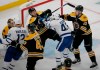 Boston Bruins defenseman Connor Clifton (75) and Toronto Maple Leafs center Nazem Kadri (43) shove each other at the goal during the third period of Game 2 of an NHL hockey first-round playoff series, Saturday, April 13, 2019, in Boston. (AP Photo/Mary Schwalm)