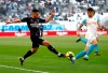 Nimes' Jordan Ferri, left, challenges for the ball with Marseille's Duje Caleta-Car, during the League One soccer match between Marseille and Nimes, at the Velodrome Stadium, in Marseille, southern France, Saturday, April 13, 2019. (AP Photo/Claude Paris)