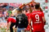 Bayern's Arjen Robben pours beer over coach Niko Kovac to celebrate Bayern's 7th straight Bundesliga title after the German Soccer Bundesliga match between FC Bayern Munich and Eintracht Frankfurt in Munich, Germany, Saturday, May 18, 2019. (AP Photo/Matthias Schrader)