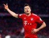 Munich's Robert Lewandowski,left, celebrates his side's third goal during the German Soccer Cup match between FC Bayern Munich and 1. FC Heidenheim in Munich, Germany, Wednesday, April 3, 2019. (AP Photo/Matthias Schrader)