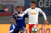 Lyon's Youssouf Kone, left, and Leipzig's Christopher Nkunku challenge for the ball during the Champions League group G first round soccer match between RB Leipzig and Olympique Lyon, in Leipzig, Germany, Wednesday, Oct. 2, 2019. (AP Photo/Jens Meyer)