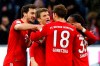 Bayern's Thomas Mueller, center, celebrates after scoring during the German Bundesliga soccer match between FC Bayern Munich and VfL Wolfsburg in Munich, Germany, Saturday, March 9, 2019. (AP Photo/Matthias Schrader)