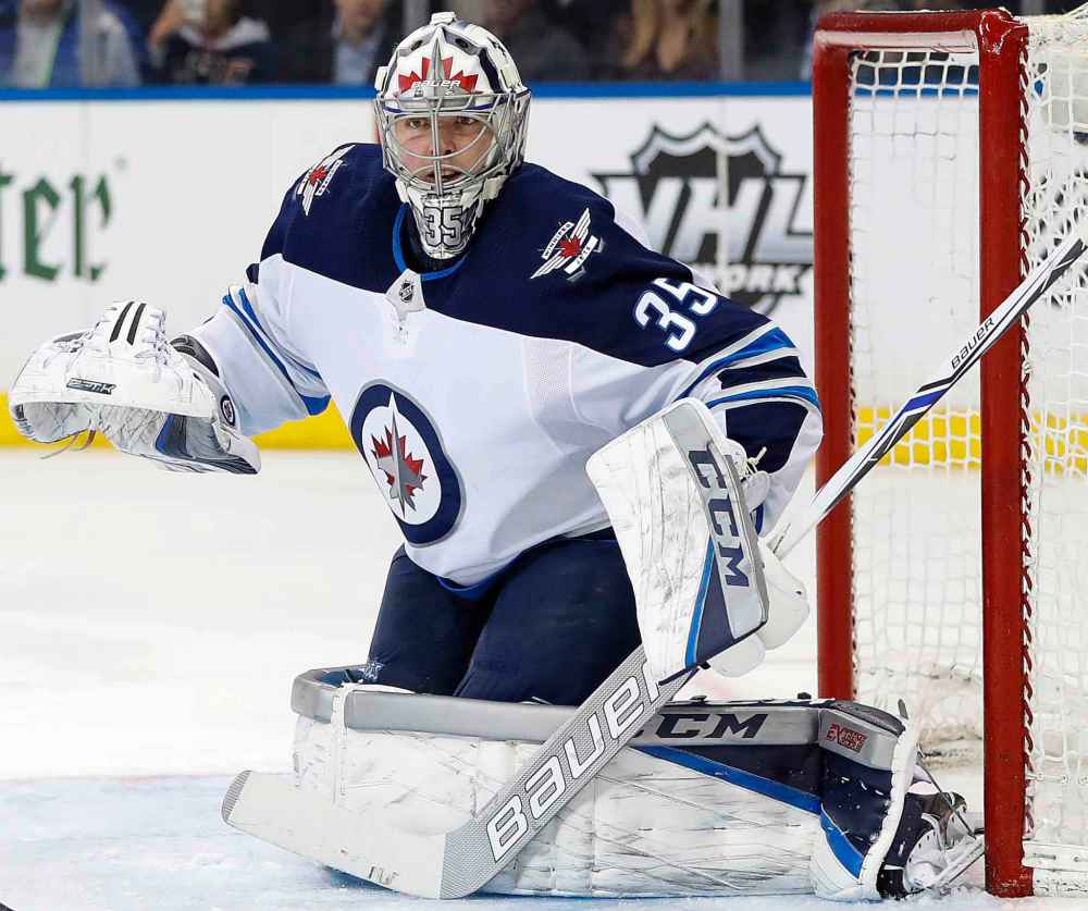 (AP Photo/Kathy Willens)
Winnipeg Jets goaltender Steve Mason (35) works in the net during the second period of an NHL hockey game against the New York Rangers in New York, Tuesday, March 6, 2018. Mason was back starting at his position for the first time since Jan. 9 after suffering a concussion.