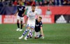 New England Revolution's Scott Caldwell (6) falls down while defending Montreal Impact's Maximiliano Urruti, left, during the first half of an MLS soccer game, Wednesday, April 24, 2019, in Foxborough, Mass. (AP Photo/Stew Milne)