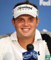 Jeff Overton answers questions from the media after completing his first round of the Deutsche Bank Championship PGA golf tournament at TPC Boston in Norton, Mass., Friday, Aug. 31, 2012. (AP Photo/Stew Milne)