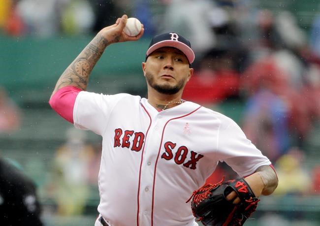 Boston Red Sox's Hector Velazquez delivers a pitch against the Seattle Mariners in the first inning of a baseball game at Fenway Park, Sunday, May 12, 2019, in Boston. (AP Photo/Steven Senne)