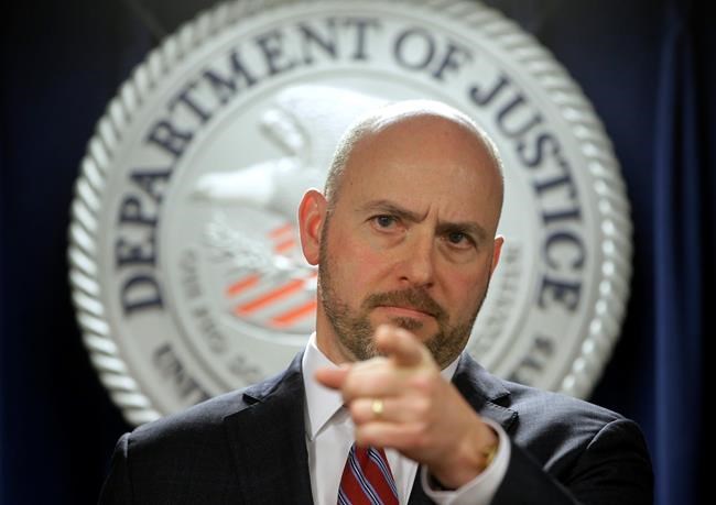 U.S. Attorney for District of Massachusetts Andrew Lelling announces indictments in a sweeping college admissions bribery scandal, during a news conference, Tuesday, March 12, 2019, in Boston. (AP Photo/Steven Senne)