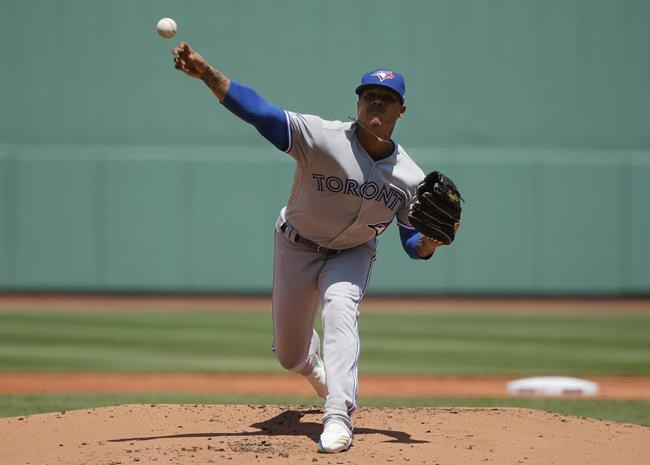 Toronto Blue Jays' Marcus Stroman delivers a pitch against the Boston Red Sox in the first inning of a baseball game in Boston, Sunday, June 23, 2019. (AP Photo/Steven Senne)