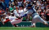 Boston Red Sox's Brock Holt, left, is tagged out by Toronto Blue Jays' Danny Jansen, right, as he attempts to score on a single by Red Sox's Jackie Bradley Jr. in the second inning of a baseball game in Boston, Sunday, June 23, 2019. (AP Photo/Steven Senne)